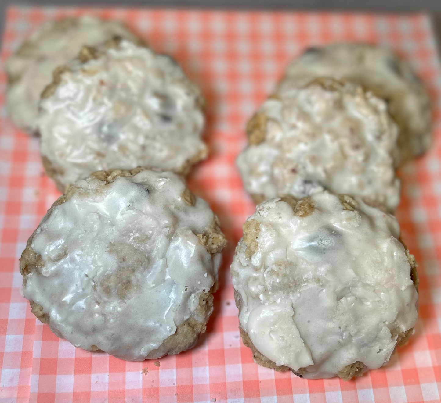 Oatmeal raisin cookies topped with icing
