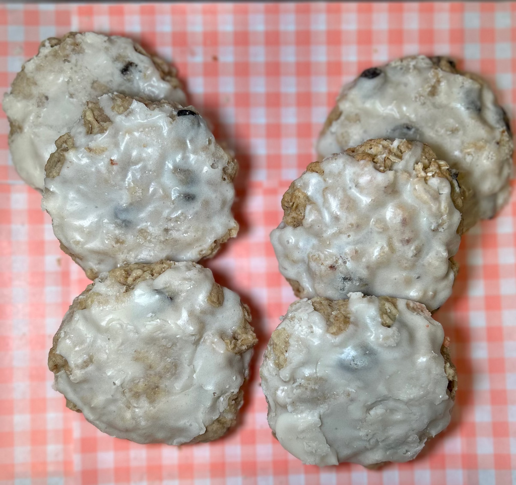 Oatmeal raisin cookies topped with icing